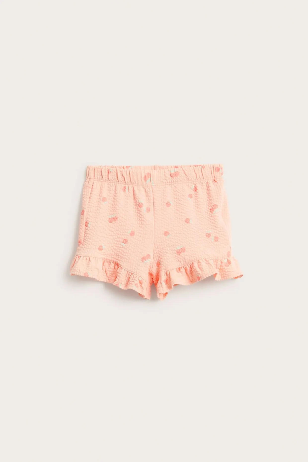 Persikkakuvioiset shortsit röyhelöreunalla | Koralli | Lapset | Kappahl