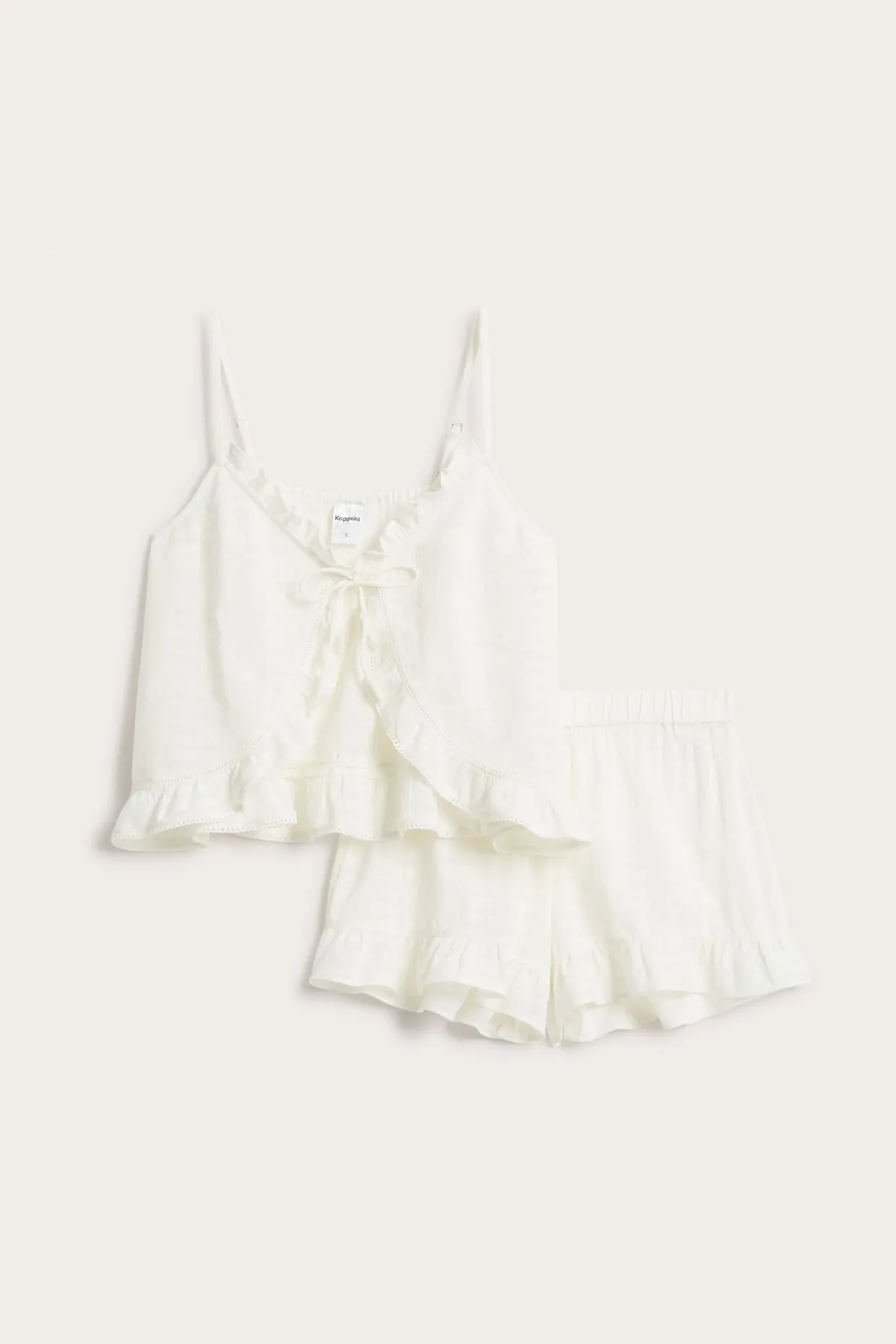 Pyjamasetti röyhelösomisteilla